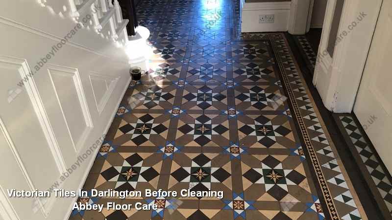 Dark and sticky Victorian tile hallway in Darlington before residue removal